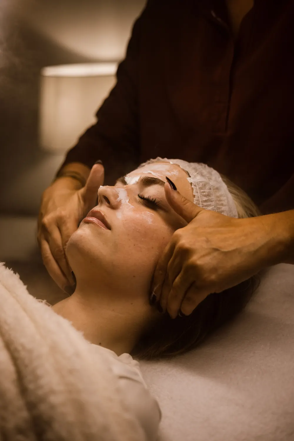 Client enjoying a relaxing facial massage